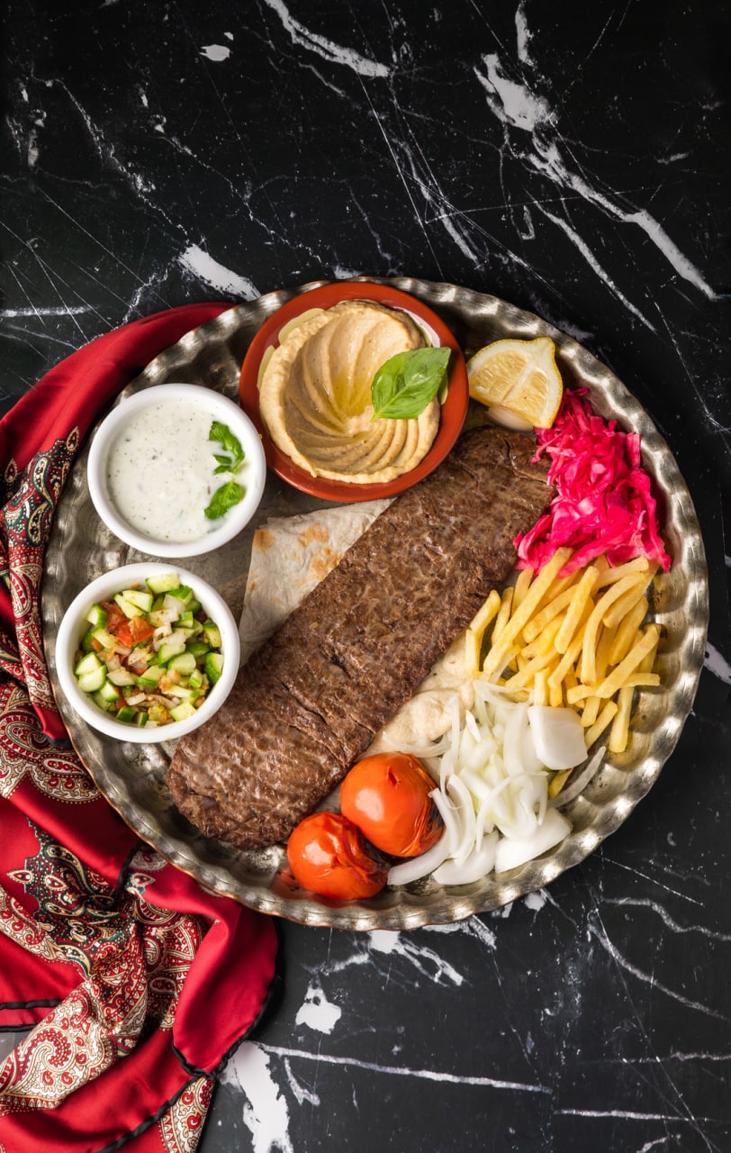 Koobideh kebab served with grilled tomato
